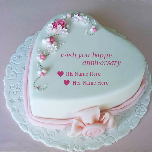 write couple name on beautiful pink heart anniversary cake